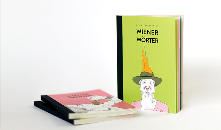 Wiener Wörter Postkarten verstreut am Tisch